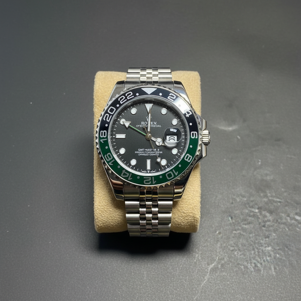 GMT style watch with green black Sprite bezel flat lay overhead shot
