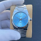 Tissot PRX style watch ice blue dial hero shot on beige cushion