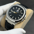 Professional photo of silver frosted nautilus watch with black dial on velvet cushion